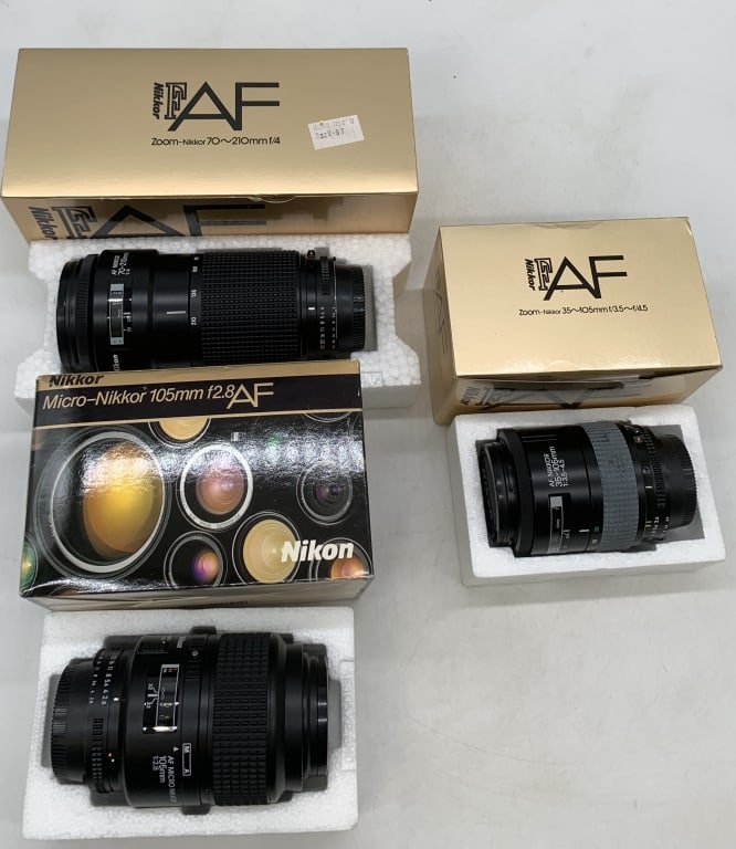3 Nikon camera lenses: 70-210mm Zoom, Micro 105mm and 35-105 mm Zoom; all items have boxes