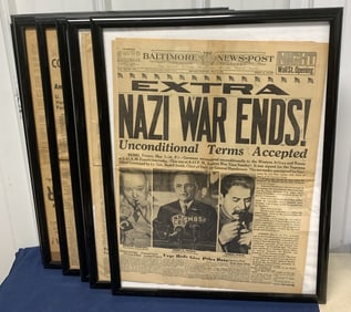 8 framed historical newspaper pages
