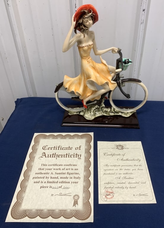 A Santini woman on bike figurine #41 of 2000: comes in original shipping box with certificates