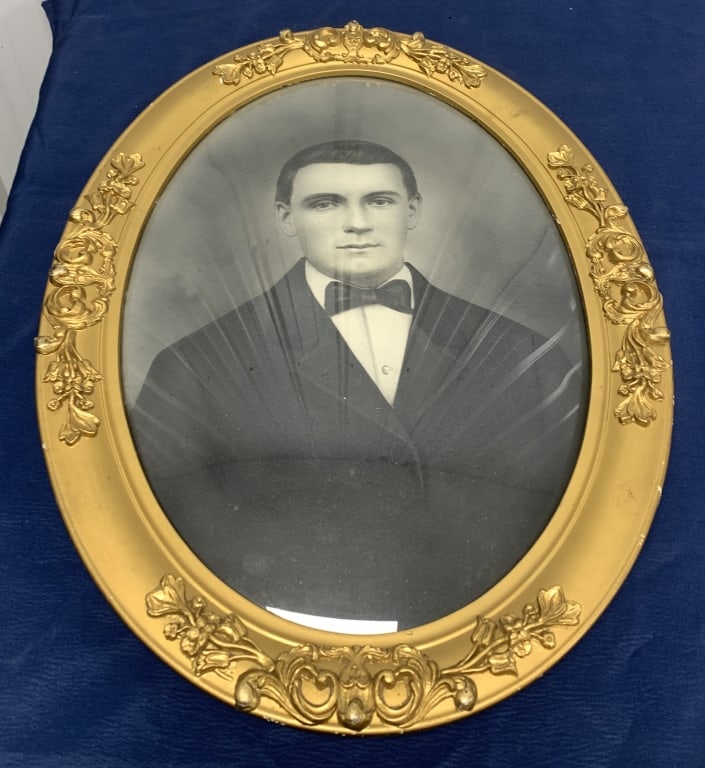 portrait in gilt frame with convex glass: has some wear