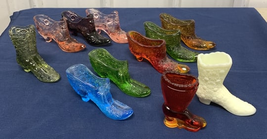 11 glass shoes and boots; one labeled Kanawha