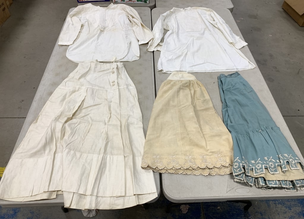 2 tunic shirts and 3 skirts: all have wear with some stains and damage