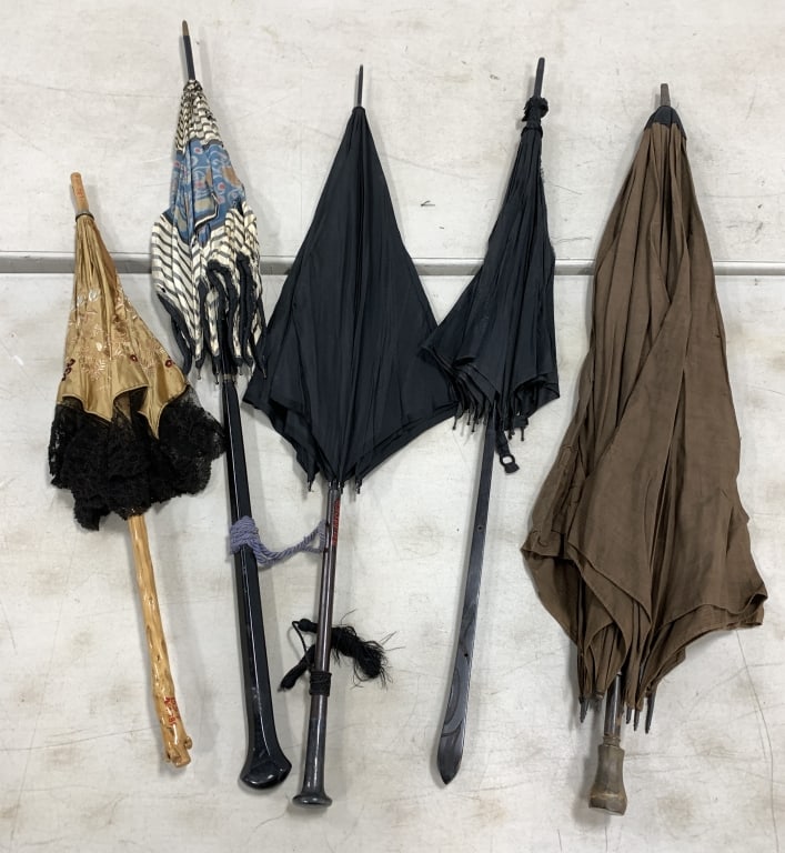5 vintage umbrellas, one handle marked sterling: all have damage to the fabric