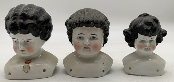 3 porcelain doll heads