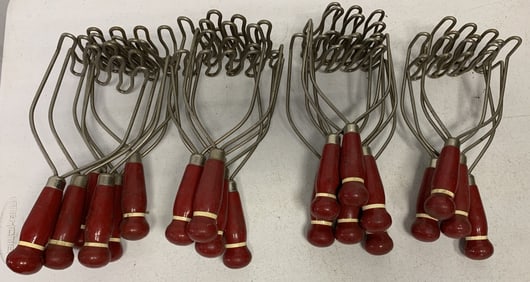 21 red handled potato mashers NOS