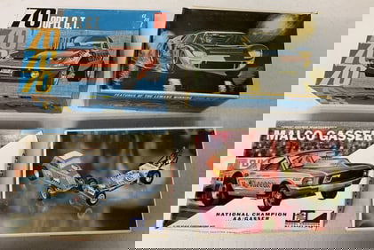 4 vintage car models in boxes