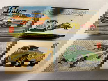 4 vintage car models in boxes