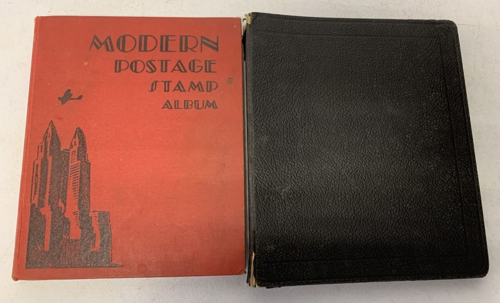 2 stamp albums: both have wear; modern postage stamp album has a lot of empty pages