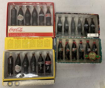4 boxes of Coca-Cola mini bottles