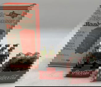 Coca-Cola bank in box and 2 sets of mini bottles