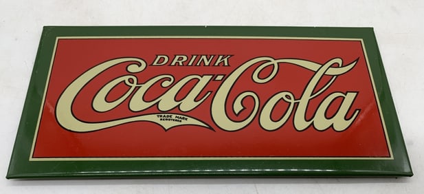 Coca-Cola metal over cardboard sign