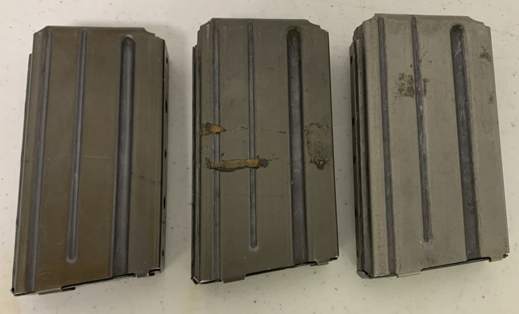 3 Colt AR-15,.223 mm Ammo Clips: 1 has tape residue,show wear