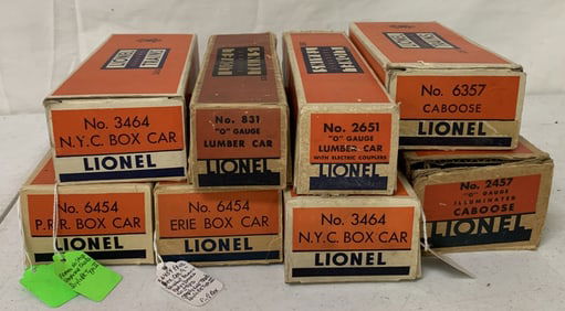8 Lionel box cars, lumber cars and cabooses