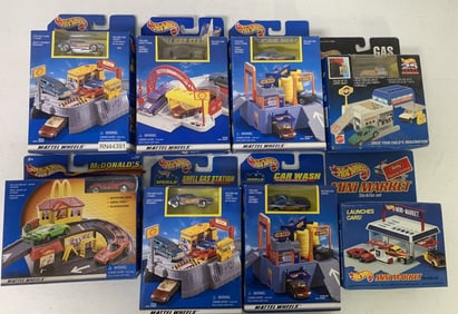 8 Hot Wheels play sets in boxes