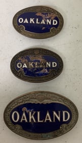 3 Oakland radiator badges