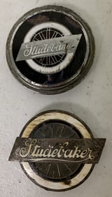 2 Studebaker radiator emblems