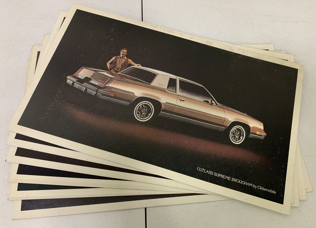 6 Cardboard Oldsmobile Posters: 27''x16 1/4''
