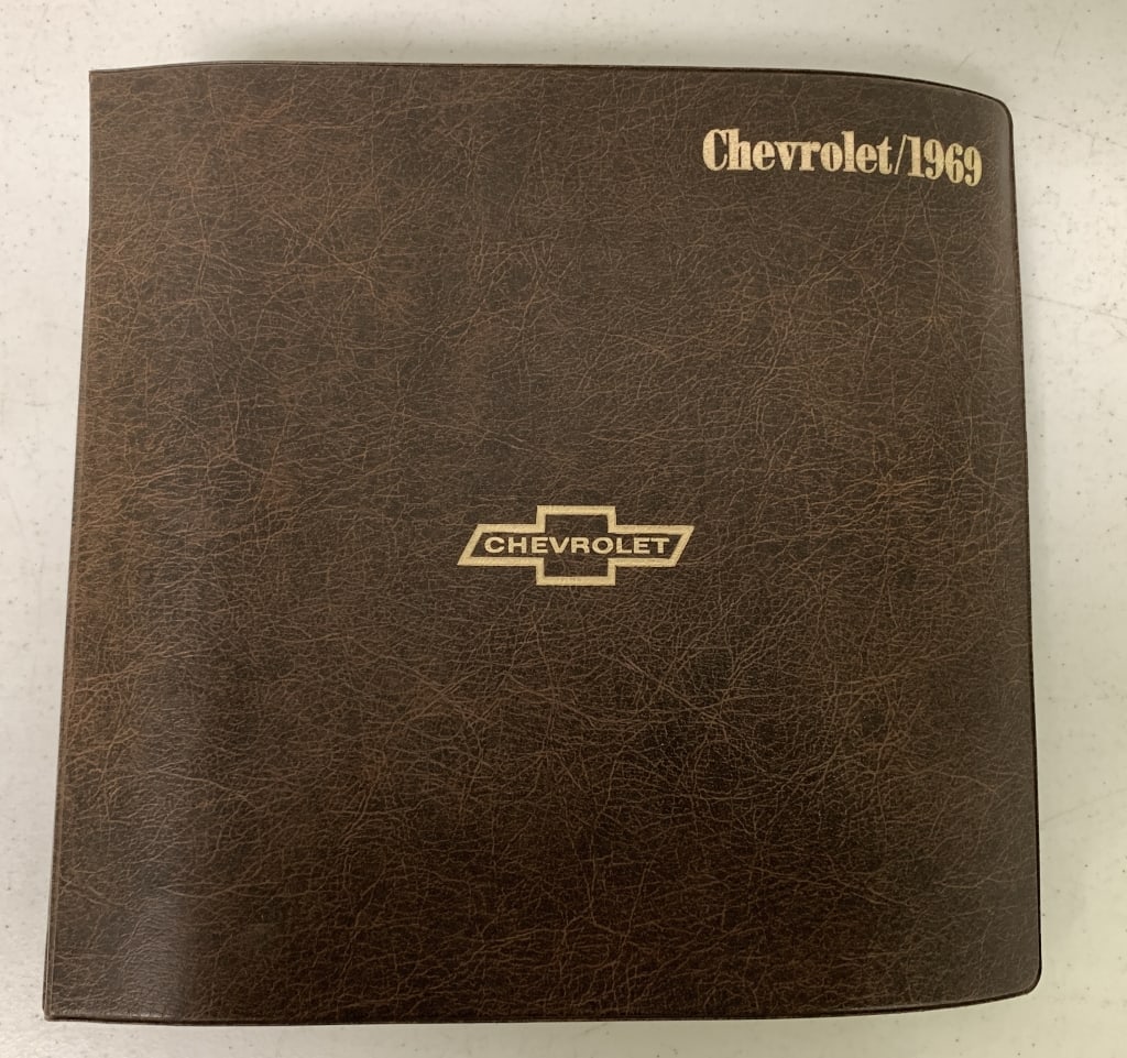 1969 Chevrolet Sales Album: binder torn at top,pages yellowing
