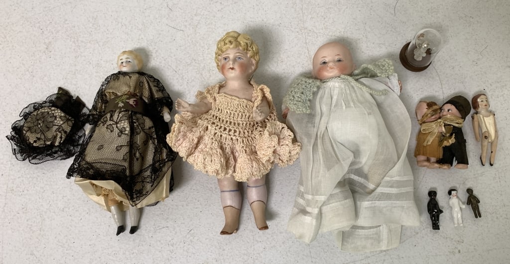 9 Vintage Dolls: porcelain, bisque, glass, composite, one small one has missing arm, small one with white head marked Germany, others unmarked, some wear and some age