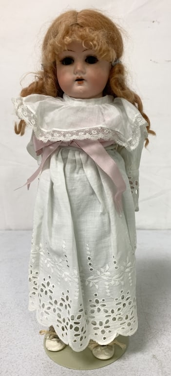 Vintage Germany Doll: bisque head, cloth body, bisque arms, Germany marked on back of body, wear and age, 14" tall, eyes open and close