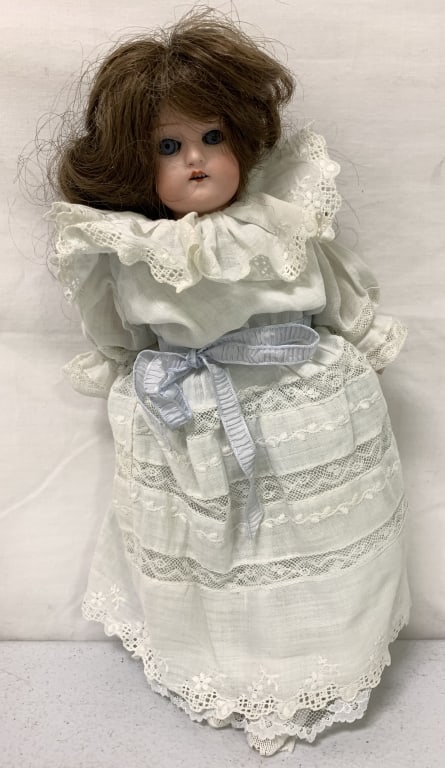 Vintage Doll: bisque head, ceramic arms, some wear and age, no names or markings, eyes open and close, 12" long