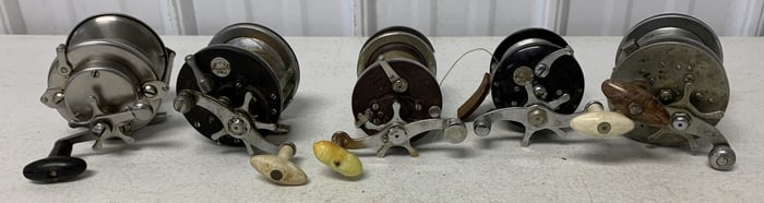 5 fishing reels, some damaged