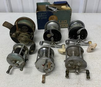 7 fishing reels, some damaged