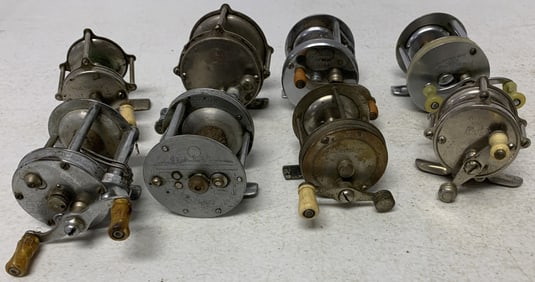 8 fishing reels, some damaged