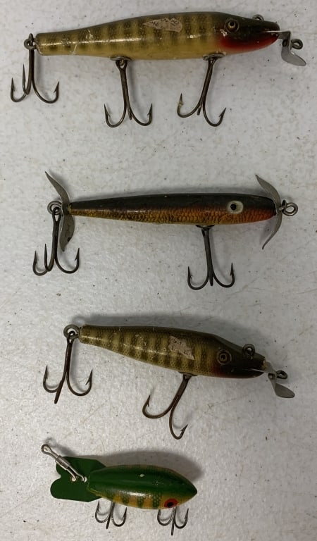 4 fishing lures: 2 CCB Co and 1 Shakespeare; have wear with some scratches and paint loss; one missing prong on hook