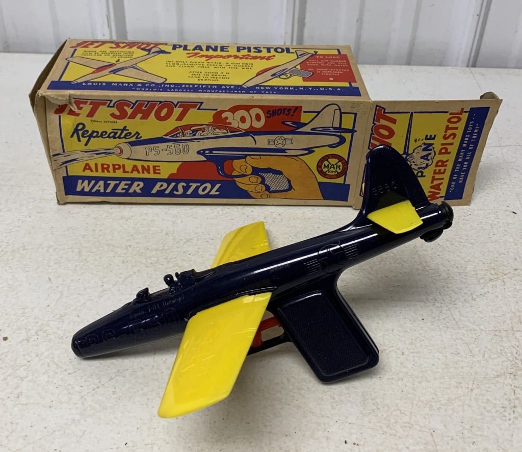 Marx Jet Shot Water Pistol in box: pistol missing cockpit cover and has small break at wing connection; box has hole in one panel and some flap tears at creases