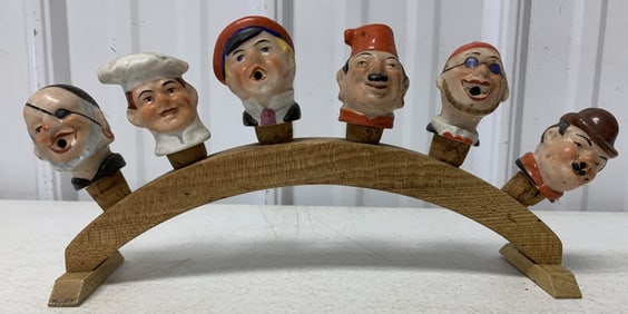 six bottle pourers on stand