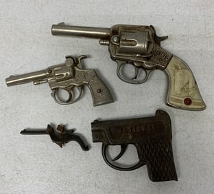 4 cast iron cap guns