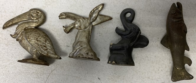 4 cast iron figural bottle openers