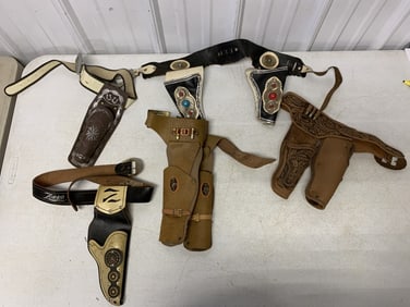 lot of cap gun belts and holsters, no cap guns