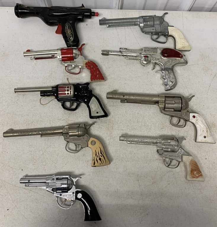 9 toy guns, not all working: space guns have damage; all show wear as seen in photos