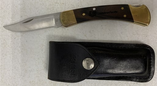 Buck 110 Louisiana Pacific knife in sheath