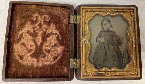 small daguerreotype of girl in gutta percha case