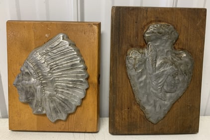 2 metal Indian plaques on wood backers