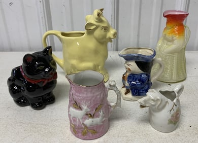 pitchers, creamers and a cat planter