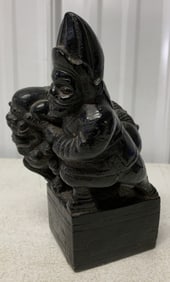 foo dog with soldier figurine