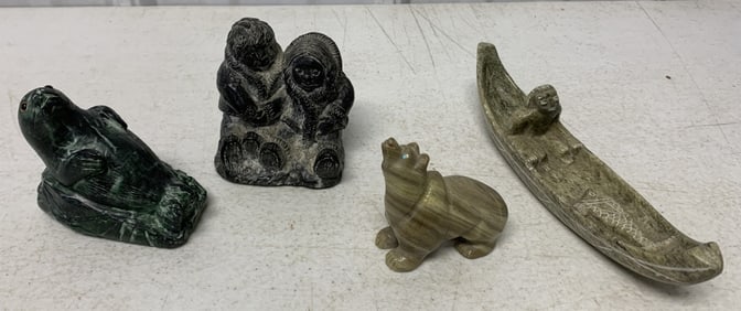 4 carvings, two marked Canada