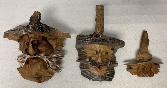 3 carved wood tree spirits