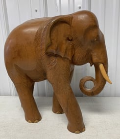 large solid wood carved elephant