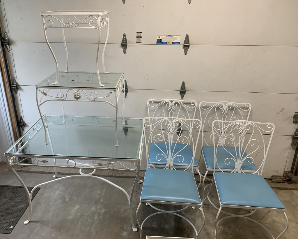 metal & glass patio set: table, 4 chairs and two end tables; have wear with scratches to glass and some rust; largest table is 30" x 42" x 30" tall; next largest table is 18"x 24" x 197/8" tall and the smallest is 16" x 16" x
