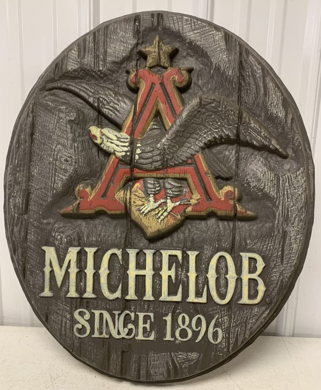 plastic Michelob sign: 27 3/4" tall x 23" wide; has wear with scratches, crack along edge; some staples holding plastic to cardboard went through plastic and are only in cardboard