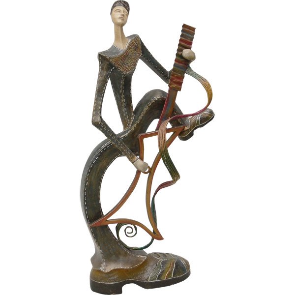 Abstract Musican: Dimensions: 13L X 8.5D X 28H This Modern Day Rocker Gets It On - Scrolled Metals and Multi colored resins gives this abstract statuette a sassy and modern feel - Great for the music lover