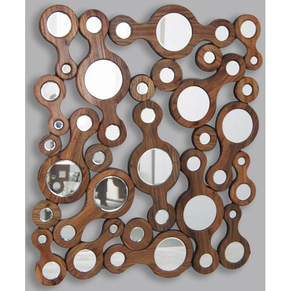 Mingled Wood & Mirror: Dimensions: 42.5W X 1.25D X 48H Constructed of hand cut wood and mirror with smooth finished edges this is mirror becomes an object of art - sold seperately is the matching console