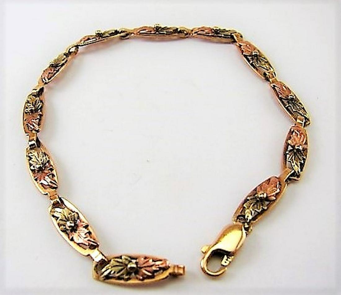 Ladies Gold 14K, 10K, Sterling Leaf Chain Bracelet: 14K yellow gold clasp and links, inset leaf's in 10K and Rose Gold, hallmarked, weighs 5.8 grams, 7.5" long