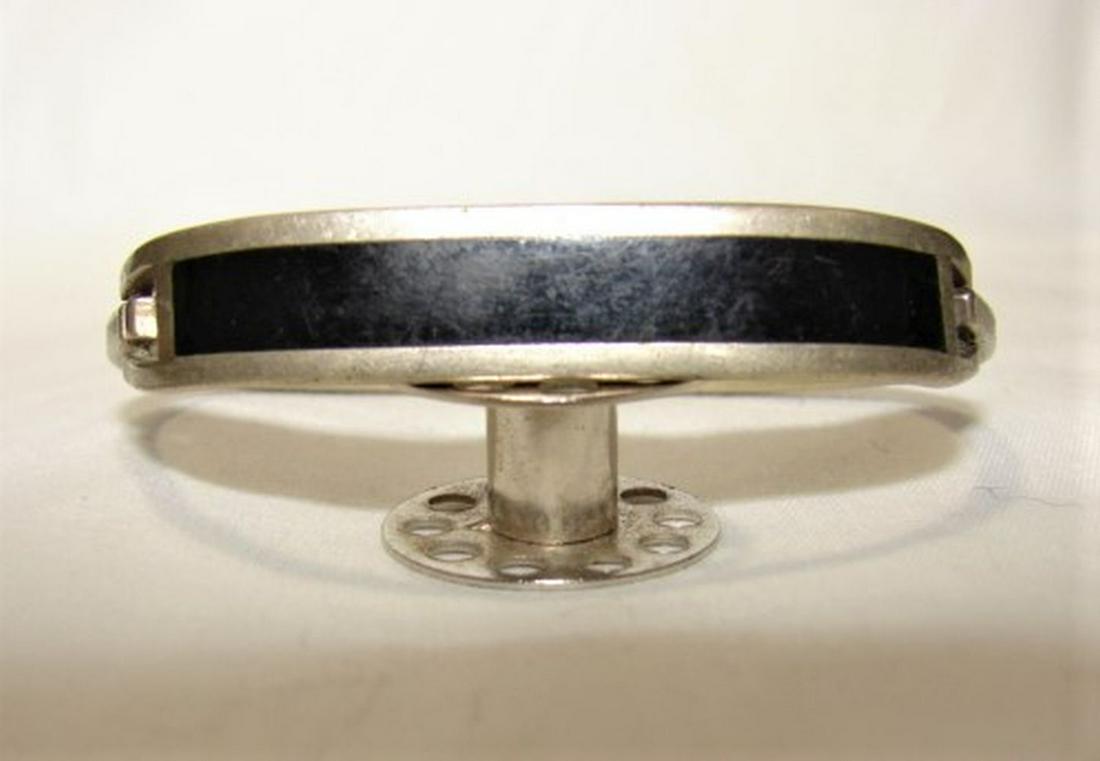 Sterling Silver and Onyx Bangle Bracelet: Marked 925 Sterling, weighs 13.5 grams, snaps open on the side and locks back into place