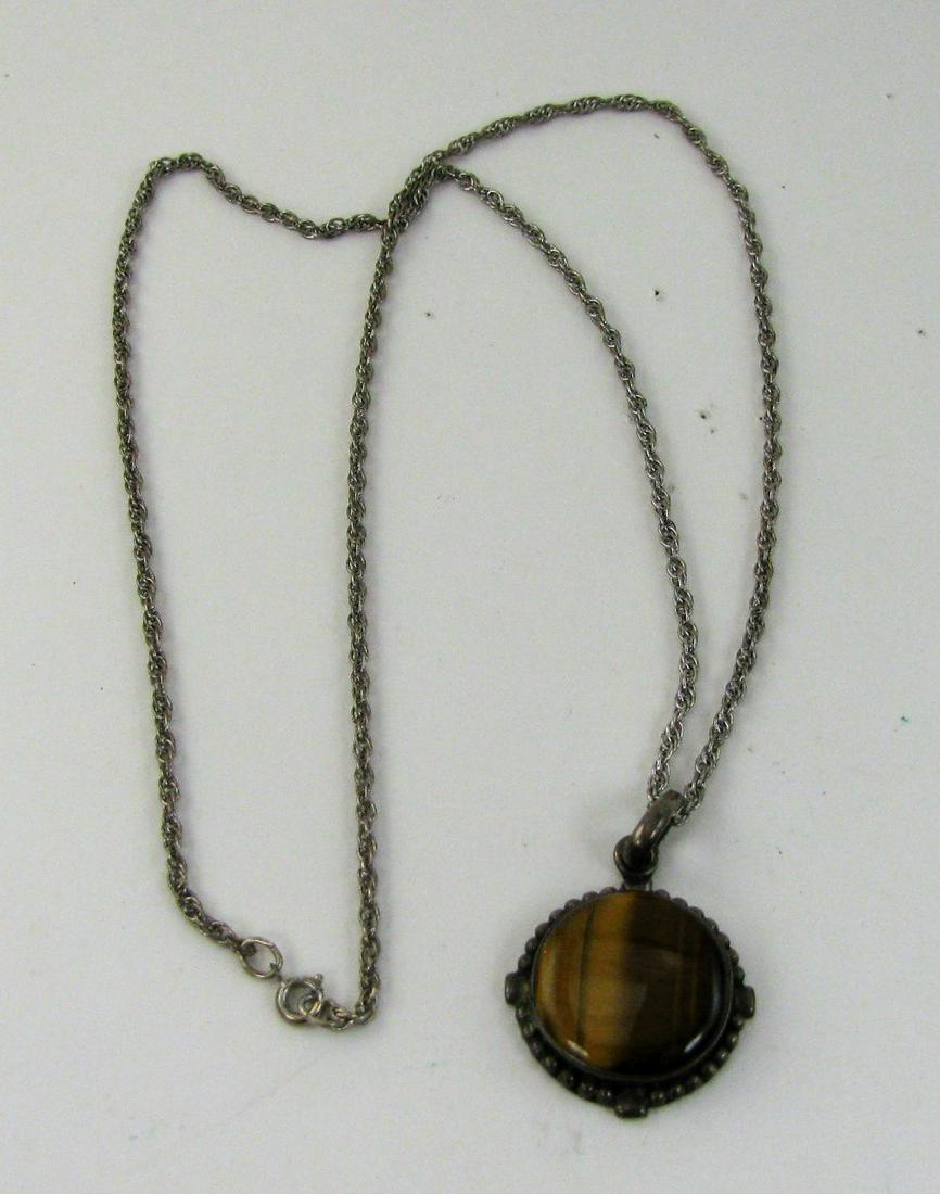 Sterling Silver Tigers Eye Pendant and Chain Necklace: Pendant dimensions 1" X 1". Total weight of pendant and chain 17.1g.